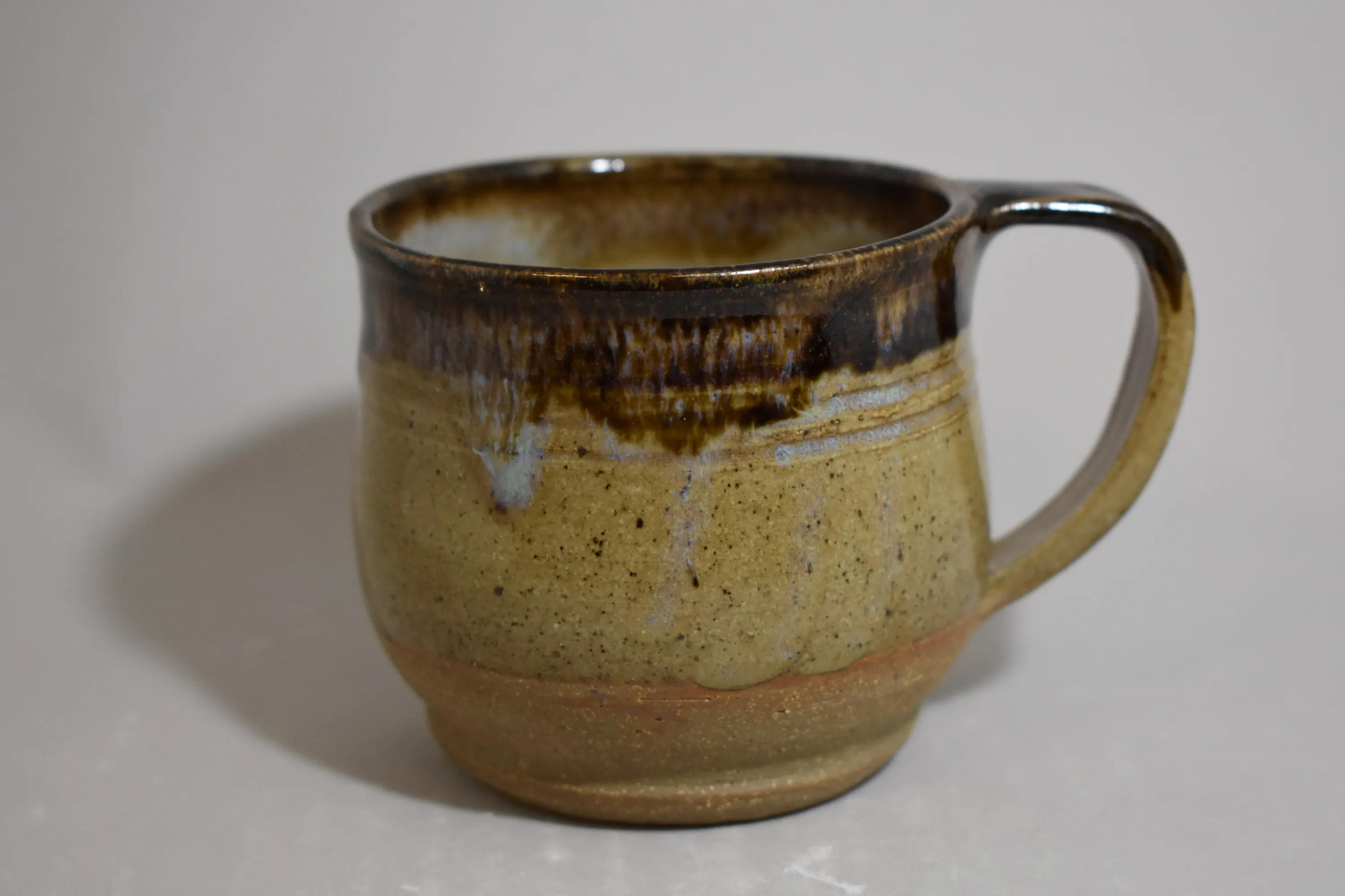 Handmade ceramic vessel with layered glaze — view 1