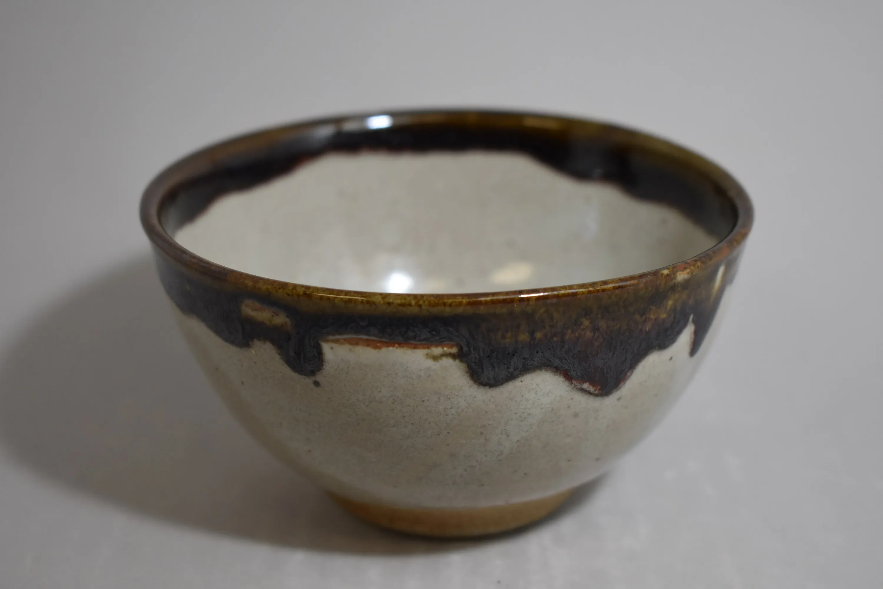 Handmade ceramic vessel with layered glaze — view 10