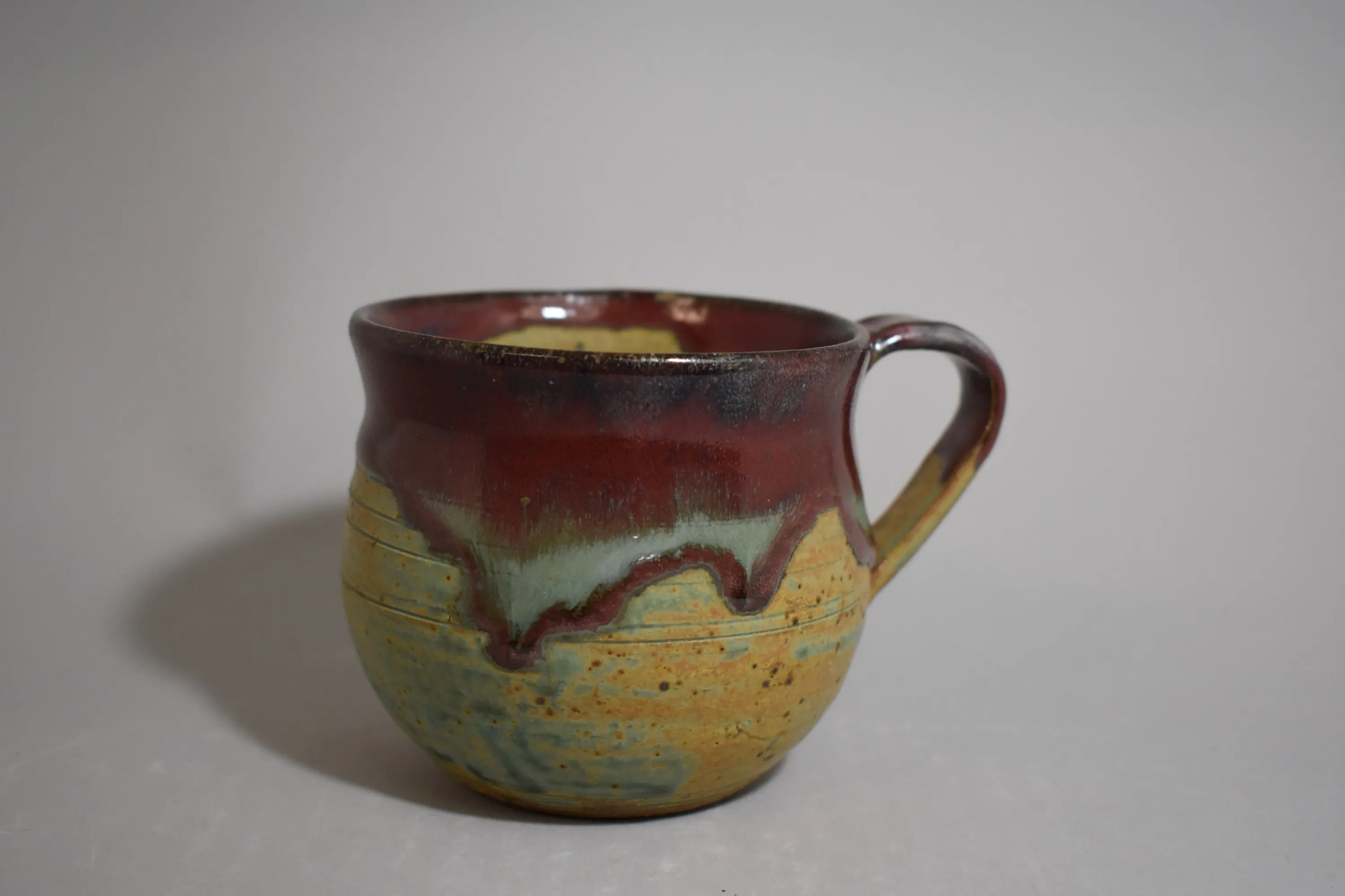 Handmade ceramic vessel with layered glaze — view 14