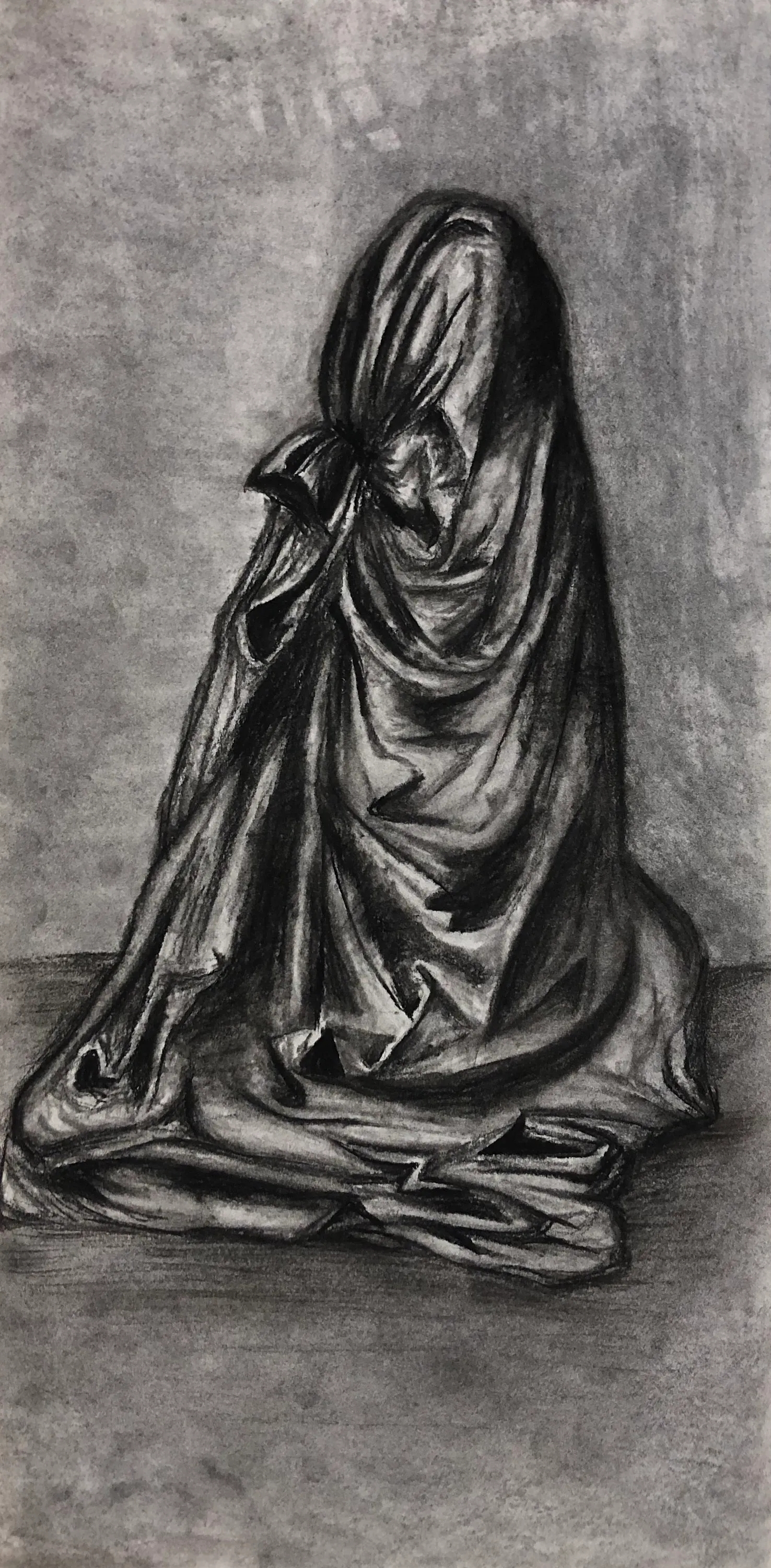 Charcoal drawing of a seated draped figure
