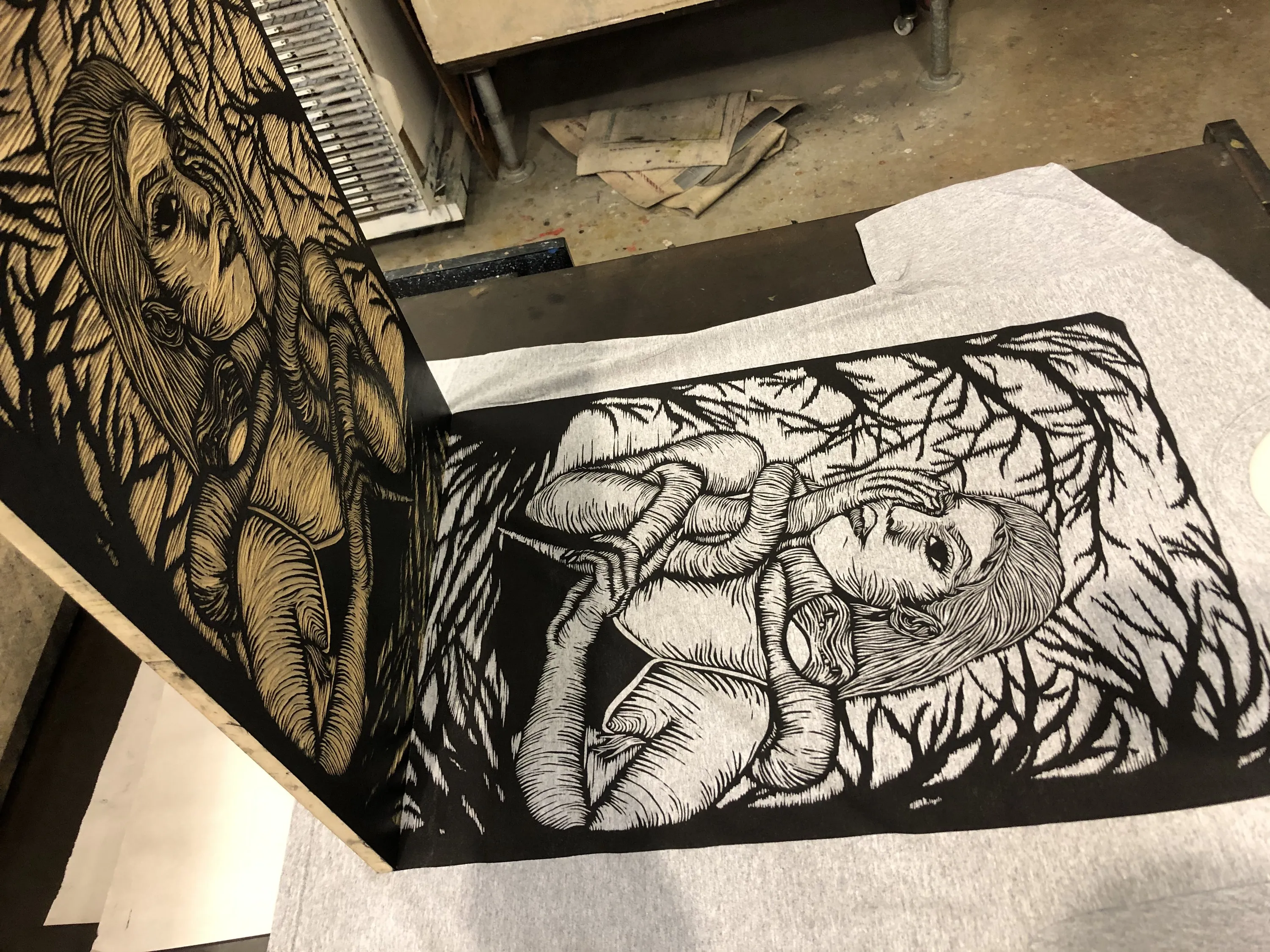 A black-and-white print being carved in the studio